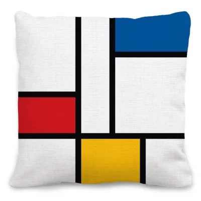 kussen met Piet Mondriaan print in blauw-geel-wit-rood met zwarte lijnen